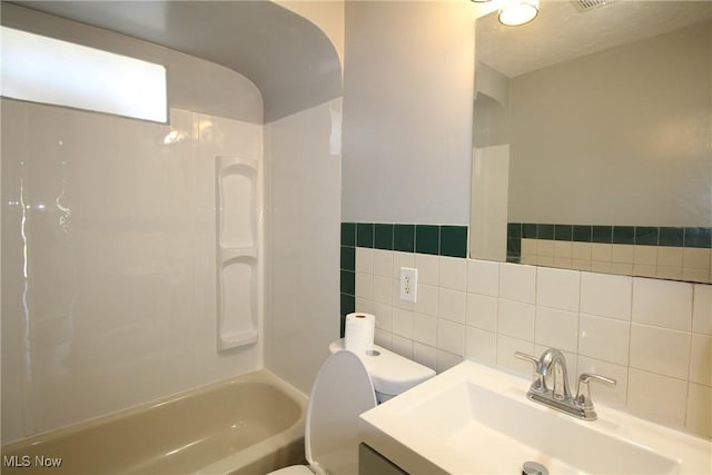 230 E 242nd St, Euclid, OH 44123 - bathroom with tile walls, shower / tub combination, and vanity