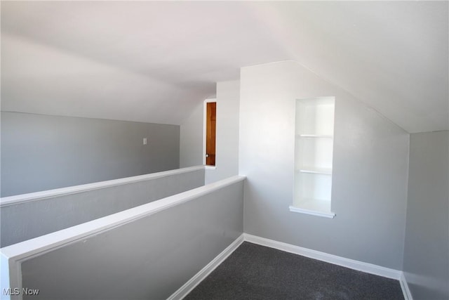 230 E 242nd St, Euclid, OH 44123 - additional living space featuring vaulted ceiling and dark colored carpet