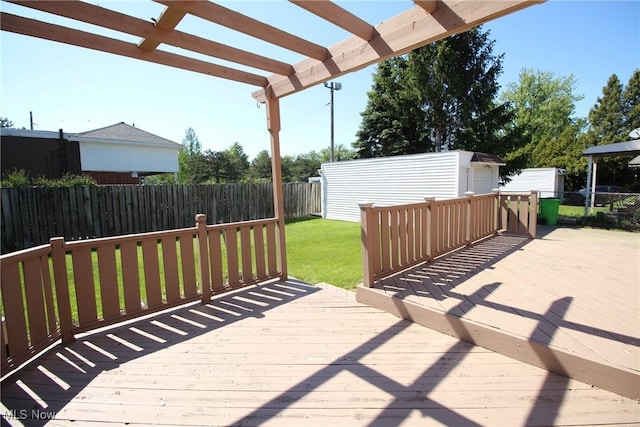 230 E 242nd St, Euclid, OH 44123 - wooden deck featuring a pergola and an outbuilding