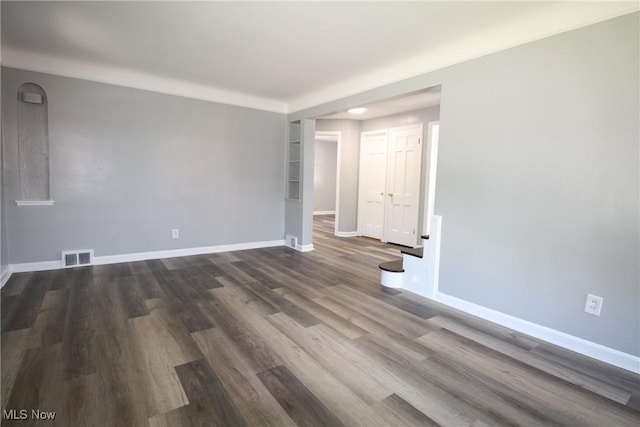 230 E 242nd St, Euclid, OH 44123 - empty room featuring baseboards and dark wood-type flooring