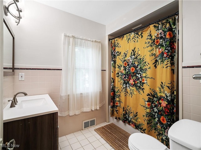 3845 Hillbrook Rd, University Heights, OH 44118 - bathroom featuring tile walls, vanity, and tile patterned flooring