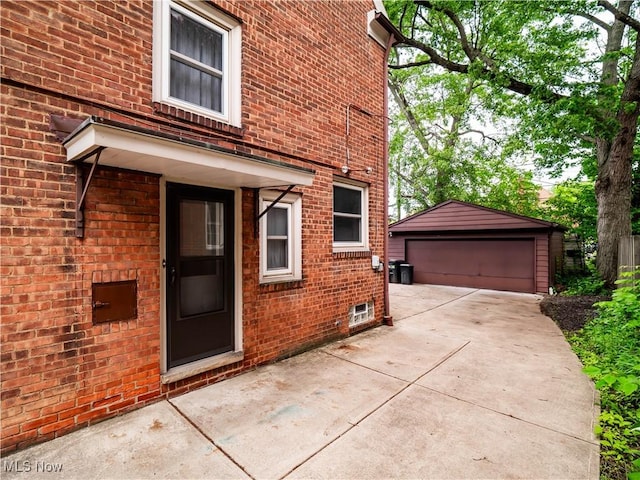 3845 Hillbrook Rd, University Heights, OH 44118 - view of side of home featuring a garage, an outdoor structure, and brick siding