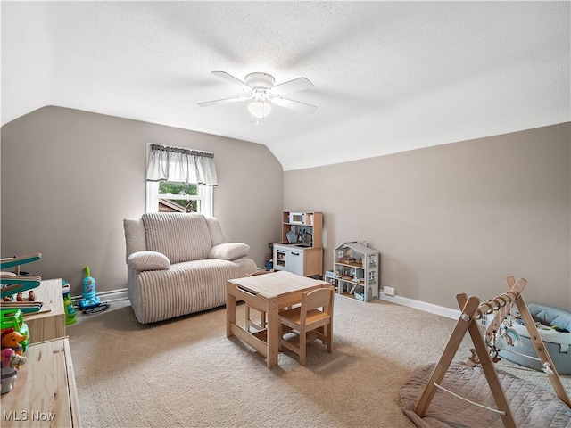 3845 Hillbrook Rd, University Heights, OH 44118 - living area with a ceiling fan, lofted ceiling, carpet flooring, and a textured ceiling