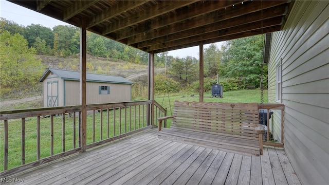 59590 Vocational Rd, Byesville, OH 43723 - wooden terrace with a shed, a lawn, and a wooded view