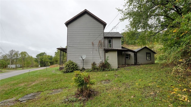 59590 Vocational Rd, Byesville, OH 43723 - view of home's exterior with a lawn