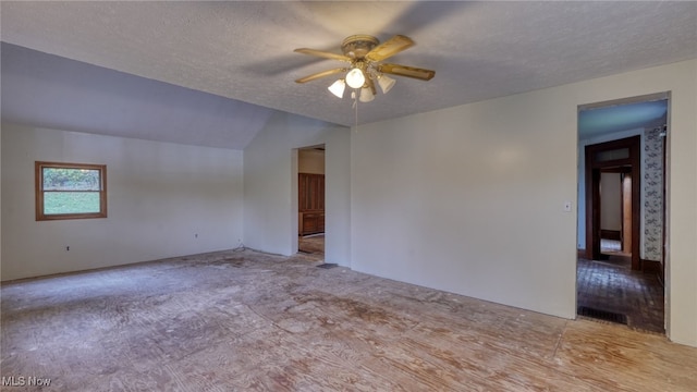 59590 Vocational Rd, Byesville, OH 43723 - spare room with a ceiling fan, a textured ceiling, lofted ceiling, and carpet