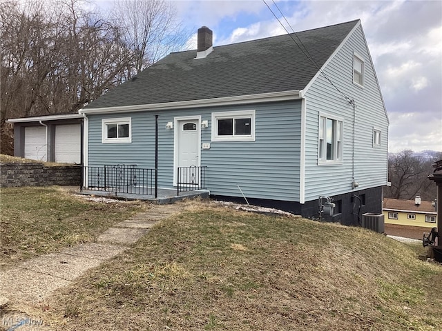 466 Lincoln Blvd, Steubenville, OH 43952 - rear view of house featuring a chimney, a yard, roof with shingles, and a garage