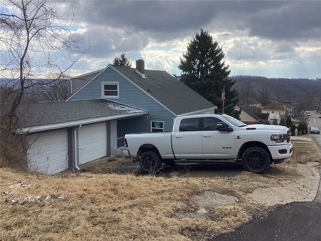 466 Lincoln Blvd, Steubenville, OH 43952 - view of property exterior featuring a shingled roof and an attached garage