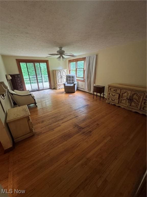 9999 Kirtland Chardon Rd, Chardon, OH 44024 - sitting room featuring a textured ceiling, wood finished floors, and ceiling fan