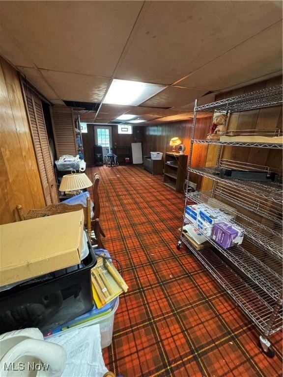 9999 Kirtland Chardon Rd, Chardon, OH 44024 - basement with wood walls and a paneled ceiling
