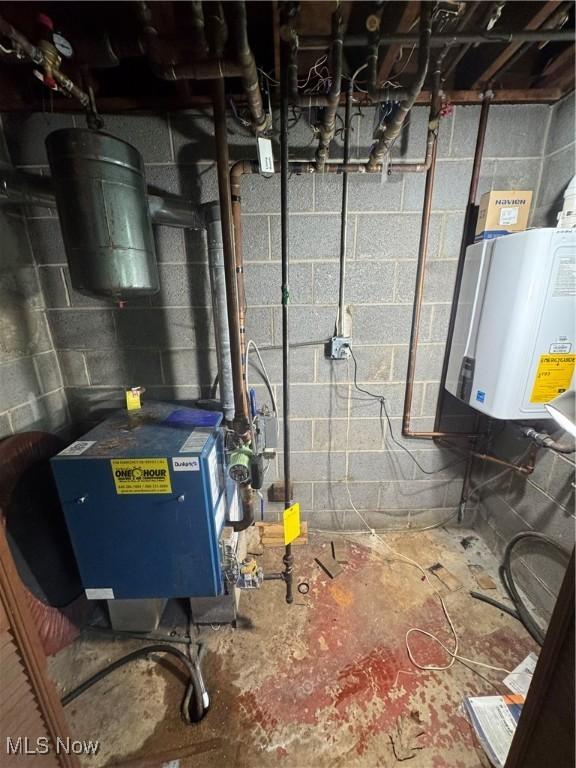 9999 Kirtland Chardon Rd, Chardon, OH 44024 - utilities with water heater and a heating unit