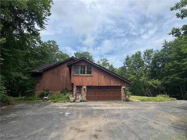 9999 Kirtland Chardon Rd, Chardon, OH 44024 - view of side of property with asphalt driveway