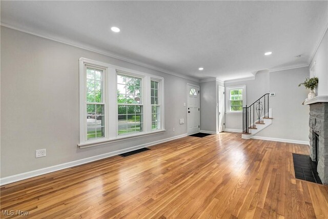 17631 Milburn Ave, Cleveland, OH 44135 - entrance foyer with crown molding, a fireplace, stairway, light wood-style floors, and recessed lighting