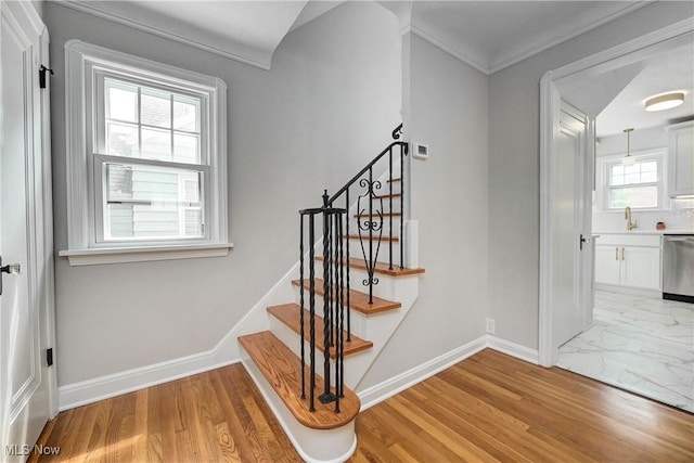 17631 Milburn Ave, Cleveland, OH 44135 - stairs featuring marble look tiles and crown molding