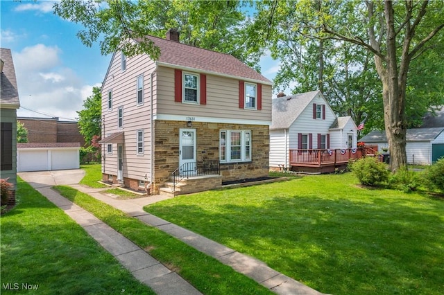 17631 Milburn Ave, Cleveland, OH 44135 - view of front of home with an outbuilding, a chimney, a front yard, stone siding, and a deck