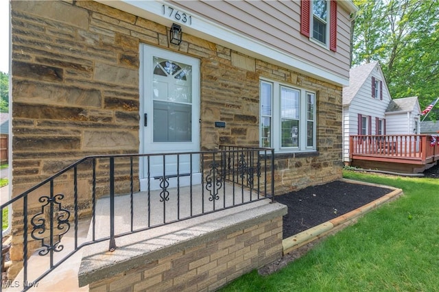 17631 Milburn Ave, Cleveland, OH 44135 - doorway to property with stone siding and a deck