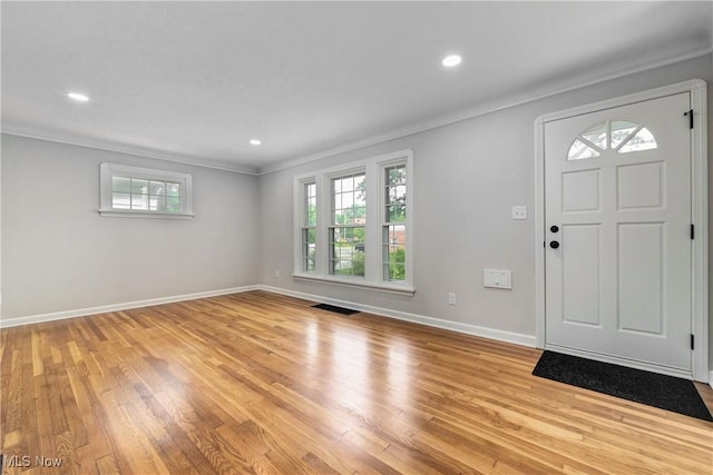 17631 Milburn Ave, Cleveland, OH 44135 - foyer entrance featuring ornamental molding, healthy amount of natural light, light wood finished floors, and recessed lighting