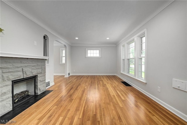 17631 Milburn Ave, Cleveland, OH 44135 - unfurnished living room featuring crown molding, wood finished floors, arched walkways, a fireplace, and recessed lighting
