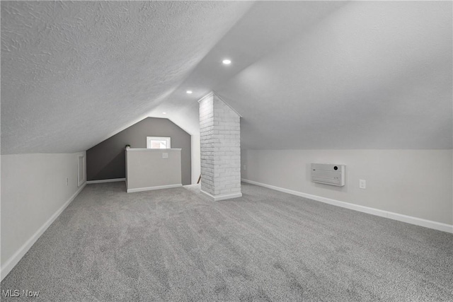 17631 Milburn Ave, Cleveland, OH 44135 - additional living space with lofted ceiling, a textured ceiling, carpet flooring, recessed lighting, and decorative columns