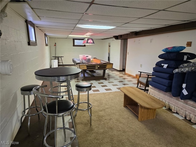 1803 Stillwagon Rd, Warren, OH 44484 - rec room with a paneled ceiling, carpet flooring, and concrete block wall