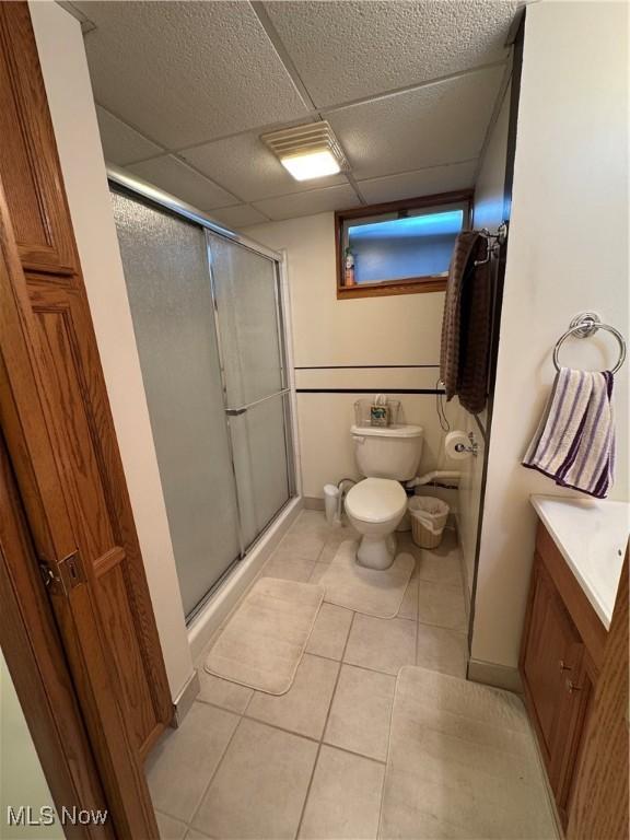 1803 Stillwagon Rd, Warren, OH 44484 - bathroom with a stall shower, vanity, tile patterned floors, and a drop ceiling