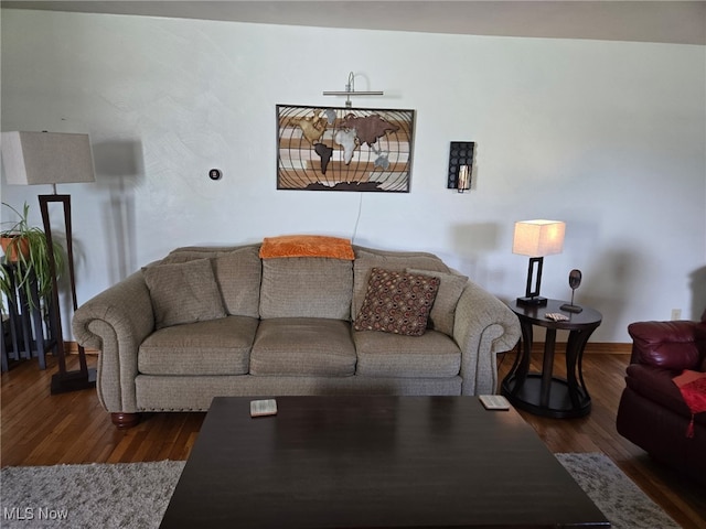 1803 Stillwagon Rd, Warren, OH 44484 - living room featuring dark wood-type flooring and baseboards