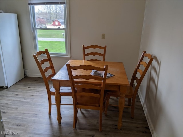 1803 Stillwagon Rd, Warren, OH 44484 - dining area with plenty of natural light and wood finished floors