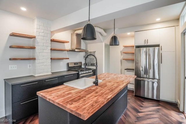 1004 Clarendon Ave SW, Canton, OH 44710 - kitchen featuring open shelves, stainless steel appliances, wooden counters, extractor fan, and recessed lighting