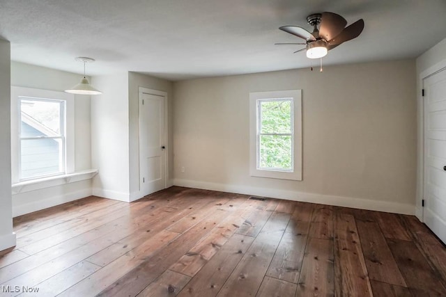 1004 Clarendon Ave SW, Canton, OH 44710 - spare room featuring wood-type flooring and ceiling fan