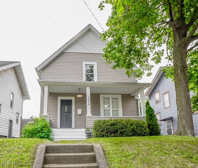1004 Clarendon Ave SW, Canton, OH 44710 - view of front of house with a porch and a front yard