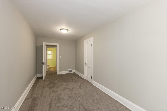 9711 Plymouth Ave, Cleveland, OH 44125 - laundry area with carpet floors and baseboards