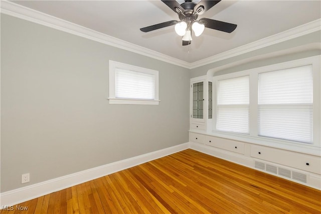 9711 Plymouth Ave, Cleveland, OH 44125 - unfurnished room with crown molding, wood finished floors, and ceiling fan