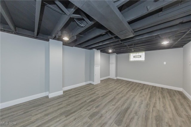 9711 Plymouth Ave, Cleveland, OH 44125 - basement with wood finished floors and baseboards