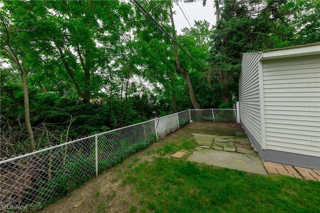 9711 Plymouth Ave, Cleveland, OH 44125 - fenced backyard featuring a patio area
