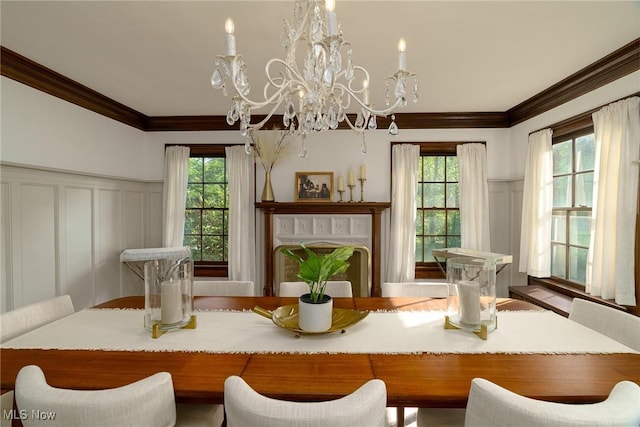 17805 Van Aken Blvd, Shaker Heights, OH 44122 - dining room with a decorative wall, crown molding, a chandelier, and wainscoting