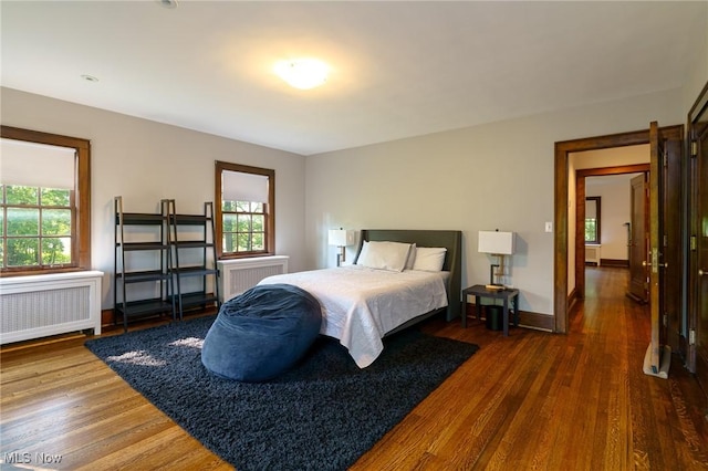 17805 Van Aken Blvd, Shaker Heights, OH 44122 - bedroom with radiator, wood finished floors, and multiple windows