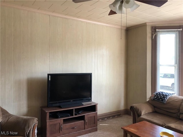 305 Adolphus St, Chester, WV 26034 - living area with plenty of natural light, a ceiling fan, wooden walls, and crown molding