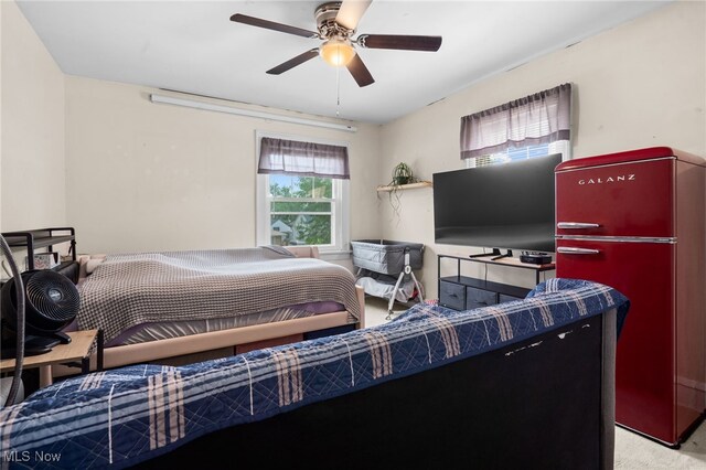 6478 Kerneywood Rd, Parma, OH 44129 - carpeted bedroom featuring freestanding refrigerator and a ceiling fan