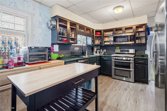 6478 Kerneywood Rd, Parma, OH 44129 - kitchen with stainless steel appliances, open shelves, wooden counters, a drop ceiling, and backsplash