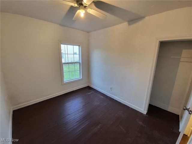 1825 Lakeview Rd, East Cleveland, OH 44112 - unfurnished bedroom with dark wood finished floors, a closet, and a ceiling fan