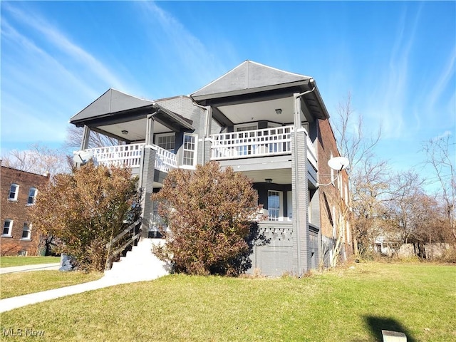 1825 Lakeview Rd, East Cleveland, OH 44112 - back of property featuring a lawn and a balcony