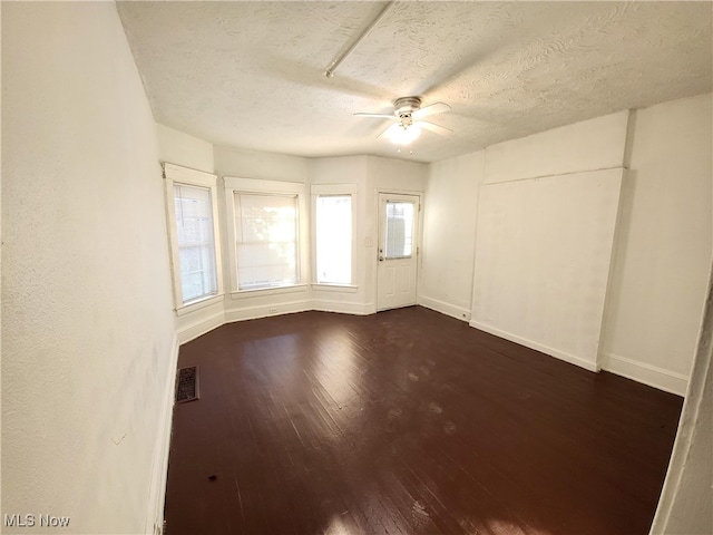 1825 Lakeview Rd, East Cleveland, OH 44112 - spare room with a ceiling fan, dark wood-style flooring, and a textured ceiling