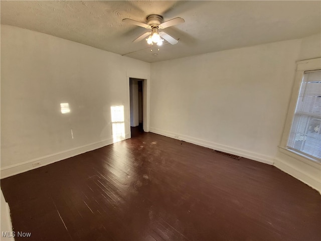 1825 Lakeview Rd, East Cleveland, OH 44112 - unfurnished room featuring dark wood-style flooring and a ceiling fan