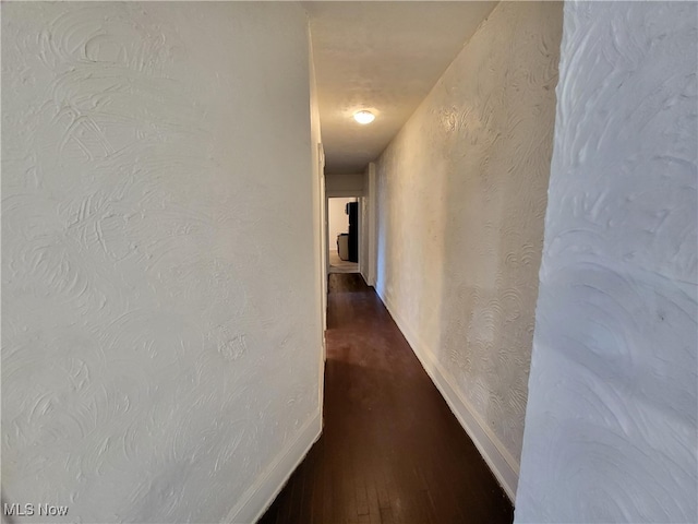 1825 Lakeview Rd, East Cleveland, OH 44112 - corridor featuring dark wood finished floors and a textured wall