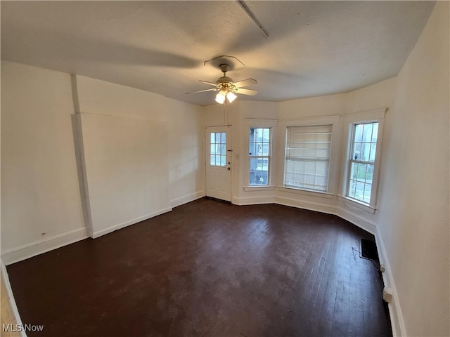 1825 Lakeview Rd, East Cleveland, OH 44112 - spare room with plenty of natural light, ceiling fan, and dark wood finished floors