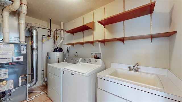 44 Gullybrook Ln, Willoughby, OH 44094 - laundry area with washer and dryer, light tile patterned floors, a textured ceiling, and heating unit