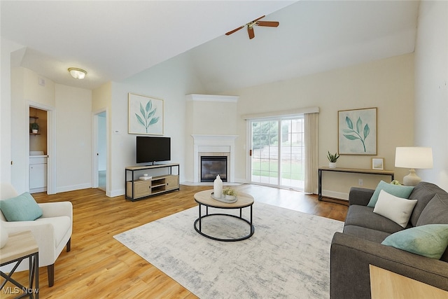 44 Gullybrook Ln, Willoughby, OH 44094 - living room with ceiling fan, wood finished floors, vaulted ceiling, and a glass covered fireplace