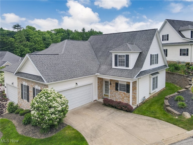 44 Gullybrook Ln, Willoughby, OH 44094 - traditional-style house with stone siding, a garage, a shingled roof, and driveway