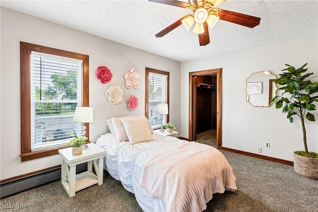 125 N Arlington Ave, Niles, OH 44446 - carpeted bedroom featuring a spacious closet, a textured ceiling, a baseboard radiator, and ceiling fan
