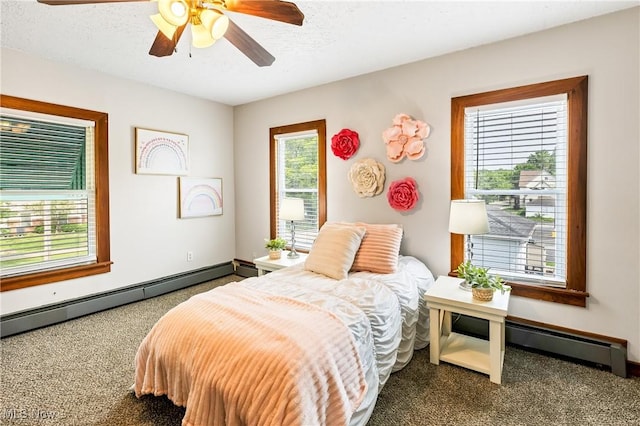 125 N Arlington Ave, Niles, OH 44446 - carpeted bedroom with a baseboard heating unit and ceiling fan
